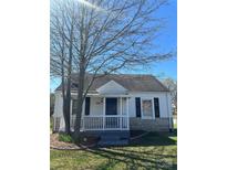 Charming home featuring a quaint front porch and a combination of siding and stone accents at 706 13Th Sw St, Hickory, NC 28602