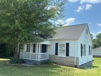 Charming single-story home featuring a cozy front porch and well-maintained lawn, perfect for relaxation at 706 13Th Sw St, Hickory, NC 28602