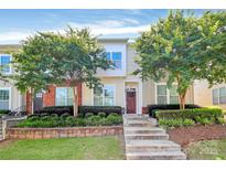 Inviting townhouse showcasing well-maintained landscaping and a charming front facade at 2726 Tranquil Oak Pl, Charlotte, NC 28206