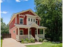 Charming two-story home with a welcoming front porch and landscaped yard, perfect for a Gathering at 423 Solomon St, Charlotte, NC 28216