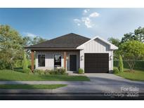 Charming single-story home featuring board and batten siding, a black garage door, and well-maintained landscaping at Lot 3 Mockingbird Rd, Albemarle, NC 28001