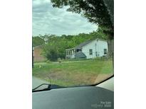 Cozy single-story home with a welcoming covered porch and ample yard space at 1024 Catawba St, Lincolnton, NC 28092