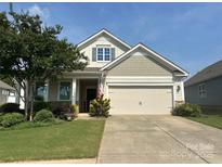 Charming two-story home with a well-manicured lawn and inviting front porch at 3835 Norman View Dr, Sherrills Ford, NC 28673