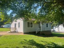 Charming home featuring a covered front porch and a well-maintained lawn at 3973 English Oak Dr, Lincolnton, NC 28092