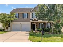 Charming two-story home featuring a two-car garage and well-maintained front yard, perfect for families at 1112 Wagner Ave # 335, Fort Mill, SC 29715