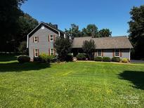 Charming single-Gathering home with lush lawn and mature trees in a tranquil setting at 204 Brentwood Dr, Maiden, NC 28650