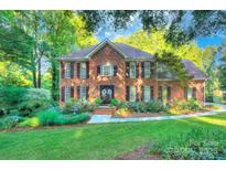 Beautiful brick home with meticulously landscaped front yard and charming curb appeal at 4831 Antioch Church Rd, Matthews, NC 28104