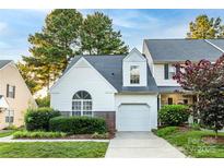 Charming home showcasing mature landscaping, a gray roof and a one car garage at 11531 Delores Ferguson Ln, Charlotte, NC 28277