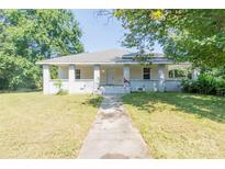 Charming single-story home with a welcoming front porch and well-maintained yard at 1818 Stowe Ave, Gastonia, NC 28054