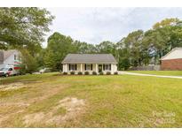 Charming single-story home featuring a well-maintained lawn and classic architectural details at 2460 Prince Dr, Lancaster, SC 29720