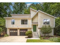 Charming two-story home with attached garage and a neatly landscaped front yard and an eye catching modern roofline at 7434 Lawyers Station Dr, Mint Hill, NC 28227
