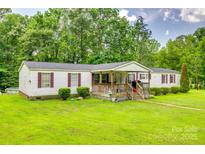 Charming single-story home with a well-manicured lawn and welcoming front porch at 10435 Silver Mine Rd, Fort Mill, SC 29707
