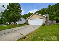 Charming home with a two-car garage and well-maintained lawn on a sunny day at 1312 Shenandoah Cir, Rock Hill, SC 29730