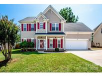 Charming two-story home with well-maintained lawn, red shutters, and an attached two-car garage at 198 Devon Forest Dr, Mooresville, NC 28115