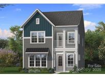 Charming two-story home showcasing a modern design with a covered front porch and a mix of siding textures at 3119 Middle St # 94, Charlotte, NC 28278