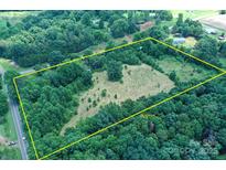 Expansive aerial view of the parcel with a mix of cleared and wooded areas, fully bordered for privacy at 4171 Leatherman Rd, Vale, NC 28168
