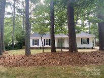 Charming home with trees in the front yard provides shade at 709 Falls Church Rd, Charlotte, NC 28270