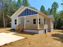 Charming single-story home with a welcoming front porch and craftsman details at 372 Lippard Farm Rd, Statesville, NC 28625