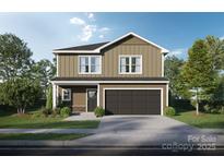 Charming two-story home featuring a classic design, complemented by lush landscaping and a two-car garage at Lot 4 Mockingbird Rd, Albemarle, NC 28001