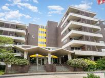 Apartment building showcasing an open-air entry and multiple balconies for each unit at 1300 Reece Rd # 402, Charlotte, NC 28209