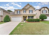 Charming two-story home with a well-manicured lawn and a two-car garage at 133 Glade Valley Ave, Mooresville, NC 28117