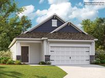 Charming single-story home featuring a two-car garage, a cozy front porch, and classic architectural details at 225 Runner Stone Ln, Fort Mill, SC 29715