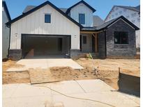 Charming new construction featuring a two-car garage and modern design at 328 Linda Carol Ln, Tega Cay, SC 29708