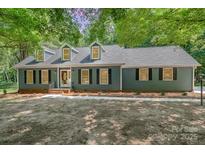 Charming home with a well-manicured lawn, complemented by mature trees and a welcoming facade at 133 Pecan Ln, Salisbury, NC 28146