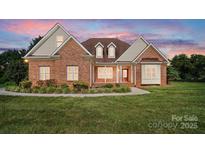 Charming brick home with a manicured lawn and inviting front entrance, perfect for families at 170 Saint James Way, Salisbury, NC 28147