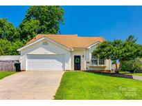 Charming single-story home featuring a well-manicured lawn and attached two-car garage at 1706 Baylor Dr, Rock Hill, SC 29732