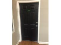 Dark, secure front door with unit number 328 at 201 S Hoskins Rd # 328, Charlotte, NC 28208