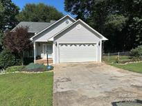 Charming single-Gathering home features a well-maintained lawn and attached two-car garage at 230 Poston Cir, Shelby, NC 28152