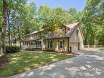 Charming home with a large yard, side entry garage, and inviting front porch at 3701 Bounty Ct, Matthews, NC 28104