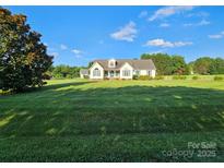 Charming one-story home with a well-manicured lawn and lush landscaping at 417 Garret Ln, York, SC 29745