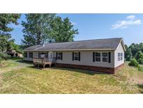 Charming ranch home with a welcoming front porch and well-maintained lawn in a serene setting at 6314 Providence Church Rd, Vale, NC 28168