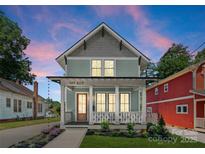 Charming two-story home with a welcoming front porch and landscaped yard at 419 Solomon St, Charlotte, NC 28216