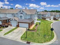Charming townhome with manicured lawn, two-car garage, and inviting curb appeal at 44424 Oriole Dr # 200, Indian Land, SC 29707