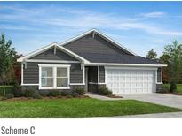 Charming single-story home featuring stone accents, horizontal siding, and a two-car garage at 4461 Family Trail Dr, Indian Land, SC 29707