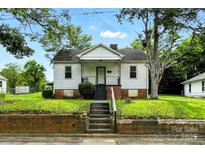 Charming single Gathering home with a cozy front porch and inviting curb appeal at 450 1St Se St, Hickory, NC 28602