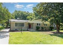 Charming single-story home with a well-maintained lawn and classic brick exterior at 1138 Laurel St, Salisbury, NC 28144