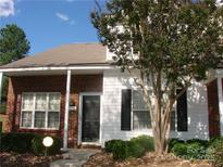 Charming brick and white two-story home with a well-maintained front yard and welcoming entrance at 1814 Birch Heights Ct, Charlotte, NC 28213
