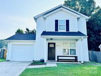 Charming two-story home with a well-maintained front lawn and inviting entrance at 5116 Crane Point Dr, Charlotte, NC 28227