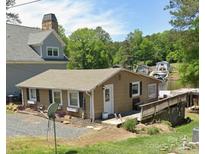 Charming single-story home with a well-maintained yard and beautiful lake views at 690 Lake Head Rd # 132, Norwood, NC 28128