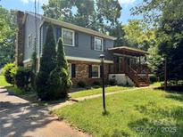 Charming two-story home with brick and siding, complemented by a welcoming front porch at 2216 Helen Dr, Gastonia, NC 28054