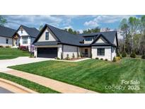 Beautiful single-Gathering home with a well-manicured lawn and attached two car garage, featuring lovely curb appeal at 4210 Holly Ne Cir, Conover, NC 28613