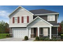 Charming two-story home features a classic design with a two-car garage and inviting front porch at 4457 Family Trail Dr, Indian Land, SC 29707