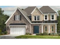 Charming two-story home featuring stone accents, a two-car garage, and a welcoming front entrance at 3073 Tramore Dr, Harrisburg, NC 28075