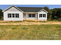 Charming single-story home with white siding, black shutters, and a well-manicured lawn at 3500 14Th Sw Ave, Hickory, NC 28602