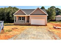 Charming single-Gathering home with a two-car garage, set against a backdrop of lush trees at 3506 14Th Sw Ave, Hickory, NC 28602