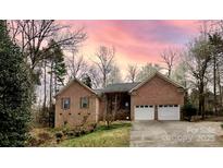 Charming brick home with two-car garage and well-maintained landscaping at 9600 Lockhorn Ct, Mint Hill, NC 28227